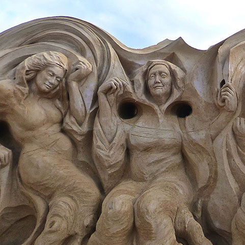 sand sculpture Norns spin the threads of fate at the foot of Yggdrasil, the tree of the world